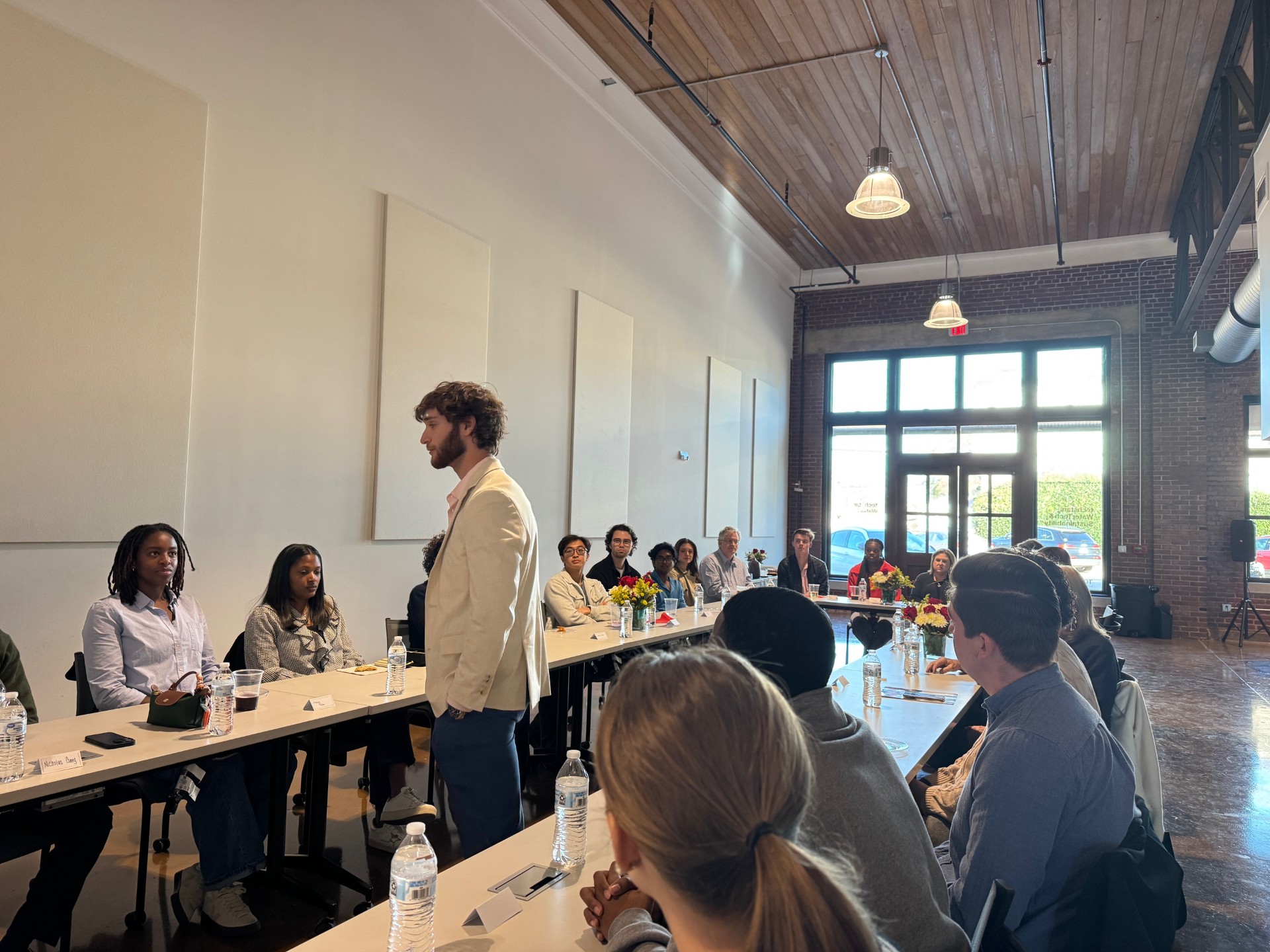 Co-Director Zach Goldman addresses the room at the inaugural TP1K giving event